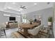 Bright dining room showcasing modern lighting, dining table set, and open space to living room at 2724 W Dewey St, Tampa, FL 33607