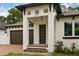 Stunning front entrance featuring modern design elements, including a stylish front door and brick steps at 2724 W Dewey St, Tampa, FL 33607
