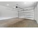 Spacious two-car garage with concrete floors and automatic door, ready for vehicles or storage at 2724 W Dewey St, Tampa, FL 33607