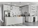 Beautiful kitchen with an island, white cabinets, modern fixtures, and lots of counter space at 2724 W Dewey St, Tampa, FL 33607