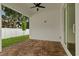 This beautiful patio features brick pavers and a ceiling fan, perfect for outdoor entertaining at 2724 W Dewey St, Tampa, FL 33607