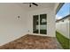 Covered outdoor patio featuring brick pavers and a ceiling fan, perfect for outdoor lounging at 2724 W Dewey St, Tampa, FL 33607