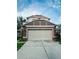 Two-story home featuring a two-car garage, concrete driveway, and well-maintained landscaping at 18135 Canal Pointe St, Tampa, FL 33647