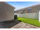 Small backyard with grassy area and privacy fence at 568 Shoreham Ne Ct, St Petersburg, FL 33716