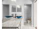 Bathroom with granite countertop, vessel sinks, and toilet at 568 Shoreham Ne Ct, St Petersburg, FL 33716