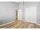 Bright bedroom with wood-look floors and double door closet at 568 Shoreham Ne Ct, St Petersburg, FL 33716