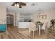 Bright dining room with a farmhouse table and chairs, adjacent to kitchen at 568 Shoreham Ne Ct, St Petersburg, FL 33716
