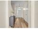 Light and airy entryway with wood-look floors and neutral walls at 568 Shoreham Ne Ct, St Petersburg, FL 33716