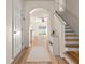 Bright entryway with light wood floors, leading to living areas and upstairs at 568 Shoreham Ne Ct, St Petersburg, FL 33716