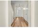 Light and airy entryway with wood-look floors and neutral walls at 568 Shoreham Ne Ct, St Petersburg, FL 33716