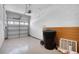 Garage with open overhead door and extra storage at 568 Shoreham Ne Ct, St Petersburg, FL 33716