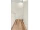 Light-filled hallway with wood-look flooring at 568 Shoreham Ne Ct, St Petersburg, FL 33716
