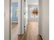Hallway with light walls and wood-look flooring at 568 Shoreham Ne Ct, St Petersburg, FL 33716