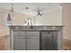 Kitchen island with granite countertop, sink, and dishwasher at 568 Shoreham Ne Ct, St Petersburg, FL 33716
