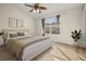 Bright main bedroom featuring a cozy bed and large window at 568 Shoreham Ne Ct, St Petersburg, FL 33716