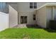 Private patio area with small grassy yard at 568 Shoreham Ne Ct, St Petersburg, FL 33716