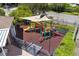 playground with shade structure, playset, and safety surface at 568 Shoreham Ne Ct, St Petersburg, FL 33716