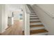 Modern staircase with light wood treads and white risers at 568 Shoreham Ne Ct, St Petersburg, FL 33716