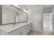 Modern bathroom with double vanity and large mirror at 3221 20Th N St, St Petersburg, FL 33713