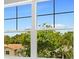 Window showcasing a tree-filled residential neighborhood at 3221 20Th N St, St Petersburg, FL 33713