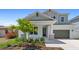 Two-story home with gray siding, stone accents, and landscaping at 3221 20Th N St, St Petersburg, FL 33713