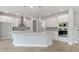 Modern kitchen with large island, stainless steel appliances, and white cabinetry at 3221 20Th N St, St Petersburg, FL 33713