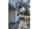 Side view of a house showing white siding at 1716 Lancelot Loop, Tampa, FL 33619