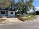 Front view of a single story house with a yard at 1716 Lancelot Loop, Tampa, FL 33619