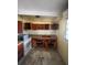 Kitchen with wooden cabinets and appliances at 1716 Lancelot Loop, Tampa, FL 33619