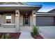 House exterior featuring a covered entryway and a two-car garage at 16115 69Th Lane E Pl, Parrish, FL 34219