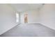 Bright bedroom with gray carpet and access to bathroom at 6907 162Nd E Pl, Parrish, FL 34219