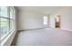 Main bedroom with carpet and large windows at 6907 162Nd E Pl, Parrish, FL 34219