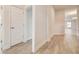 Bright hallway with wood-look tile floor at 6907 162Nd E Pl, Parrish, FL 34219