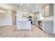 Open concept kitchen with island and gray cabinets at 6907 162Nd E Pl, Parrish, FL 34219