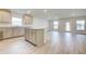 Modern kitchen with gray cabinets, granite countertops, and an island at 6907 162Nd E Pl, Parrish, FL 34219
