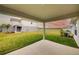 Covered patio overlooking a backyard and lake at 7030 162Nd E Pl, Parrish, FL 34219