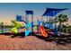 Colorful playground with slides, climbing structures, and shade coverings at 7030 162Nd E Pl, Parrish, FL 34219