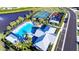 Community pool, tennis courts, playground, and parking area in an aerial view at 6818 162Nd E Pl, Parrish, FL 34219