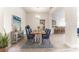 Elegant dining area with a modern wood table and blue chairs at 7014 162Nd Place E. E Pl, Parrish, FL 34219