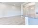 Bright dining room with tile floors and access to kitchen at 7014 162Nd Place E. E Pl, Parrish, FL 34219