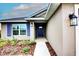 House exterior with blue shutters and walkway at 7014 162Nd Place E. E Pl, Parrish, FL 34219