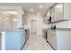 Open concept kitchen with gray cabinets at 7014 162Nd Place E. E Pl, Parrish, FL 34219