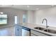 Kitchen with island, sink, and lake view at 7014 162Nd Place E. E Pl, Parrish, FL 34219