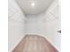 Spacious walk-in closet with wire shelving and neutral carpeting at 7014 162Nd Place E. E Pl, Parrish, FL 34219