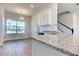 Kitchen with granite countertop and white cabinets at 16131 69Th Lane East, Parrish, FL 34219