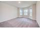 Bright bedroom featuring bay windows and grey carpet at 6814 162Nd E Pl, Parrish, FL 34219