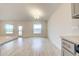 Bright dining room with wood-look tile floors and access to backyard at 6814 162Nd E Pl, Parrish, FL 34219