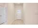 Bright and airy entryway with light wood-look flooring at 6814 162Nd E Pl, Parrish, FL 34219