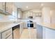 Modern kitchen with stainless steel appliances and island at 6814 162Nd E Pl, Parrish, FL 34219