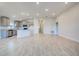 Open concept kitchen with gray cabinets and an island at 6814 162Nd E Pl, Parrish, FL 34219